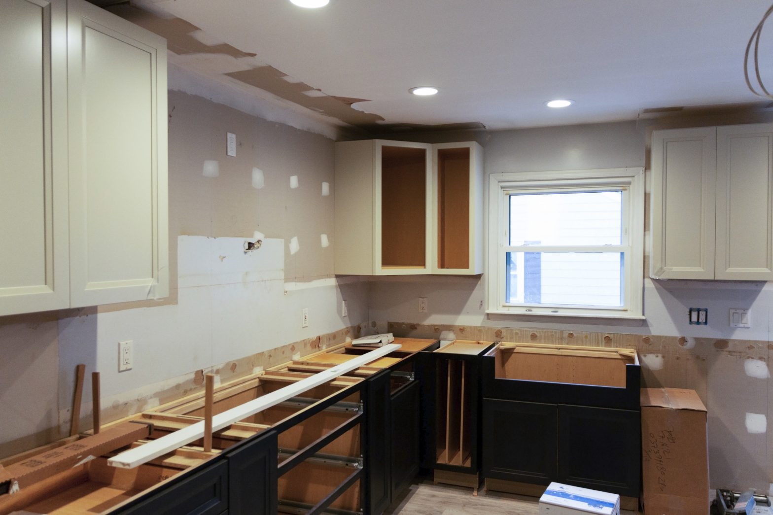 kitchen being remodeled with no countertops or appliances yet.