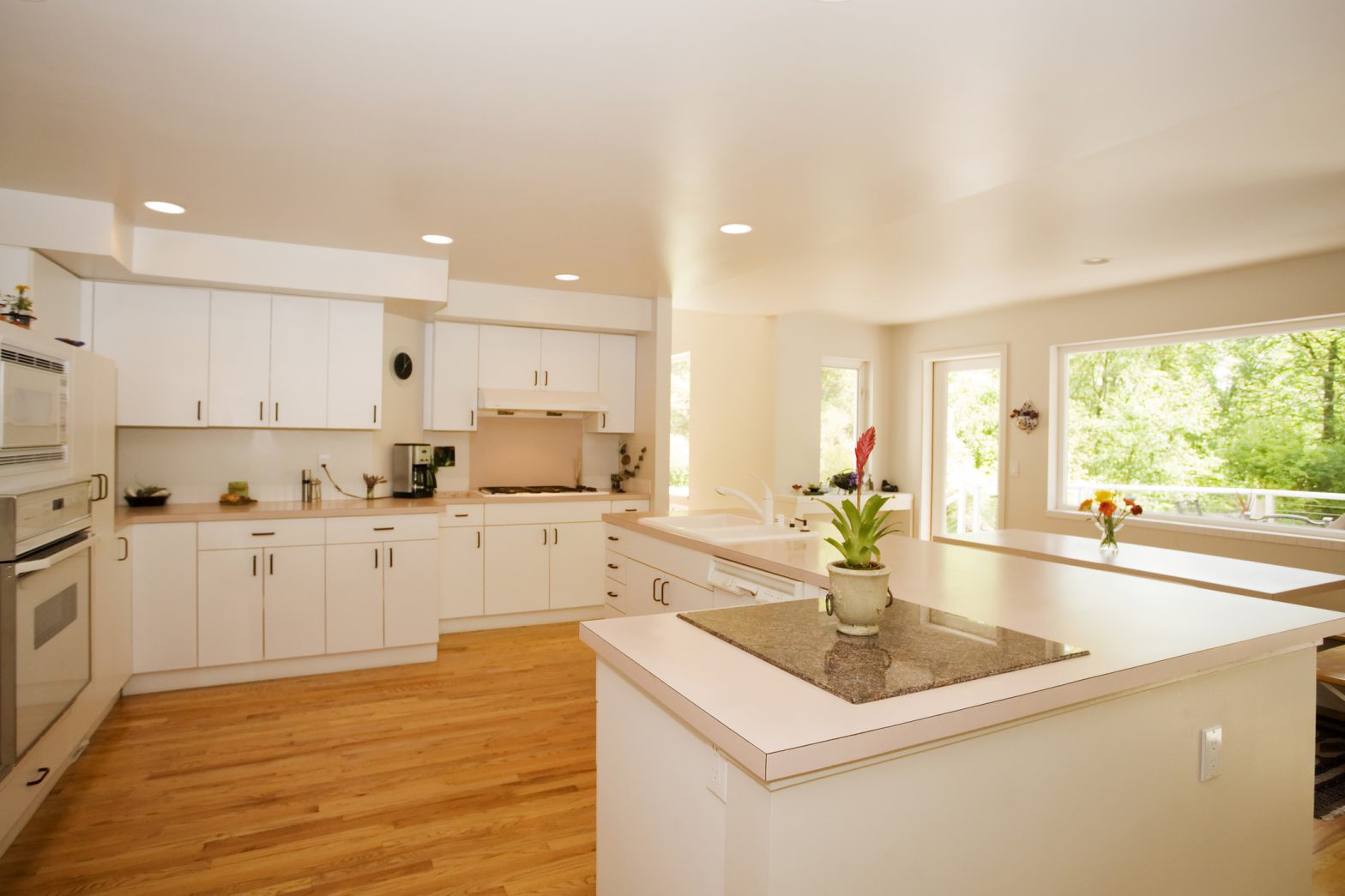 bright spacious kitchen with laminate countertops